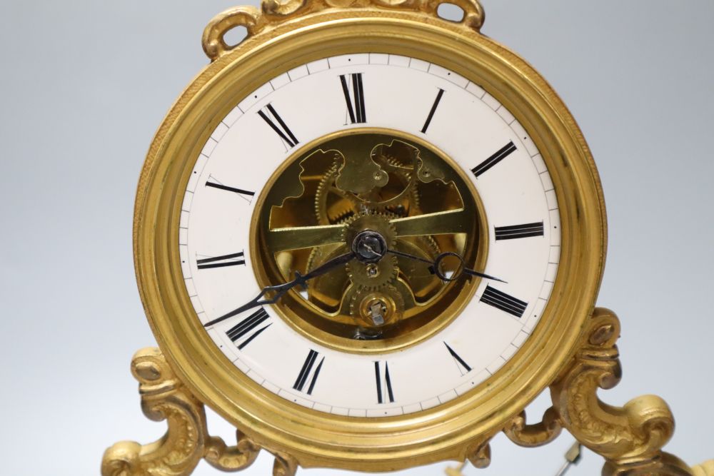 A 19th century French swinging cherub mantel timepiece under glass dome, French movement with exposed escapement, 35cm high